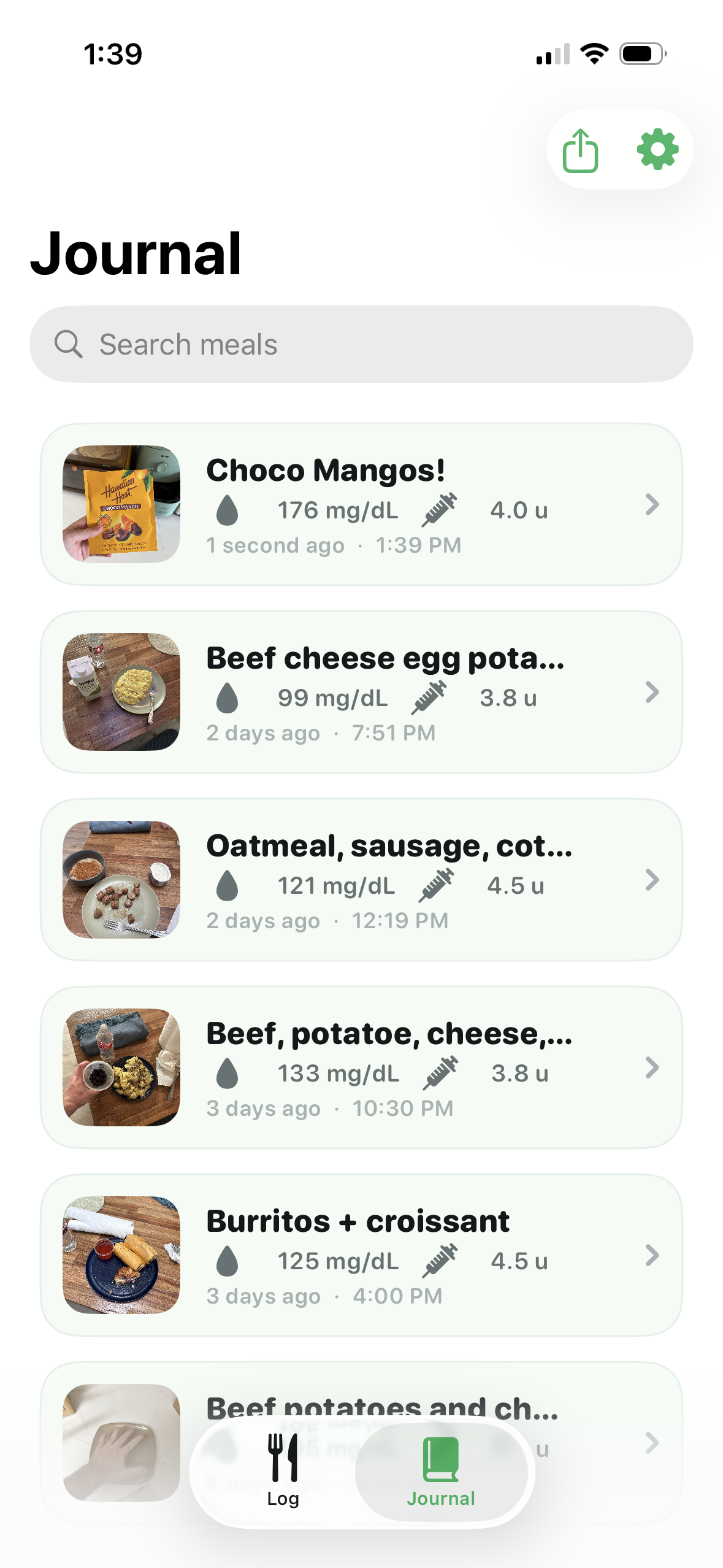 CarbLens AI journal of past meals with grades and starred meals
